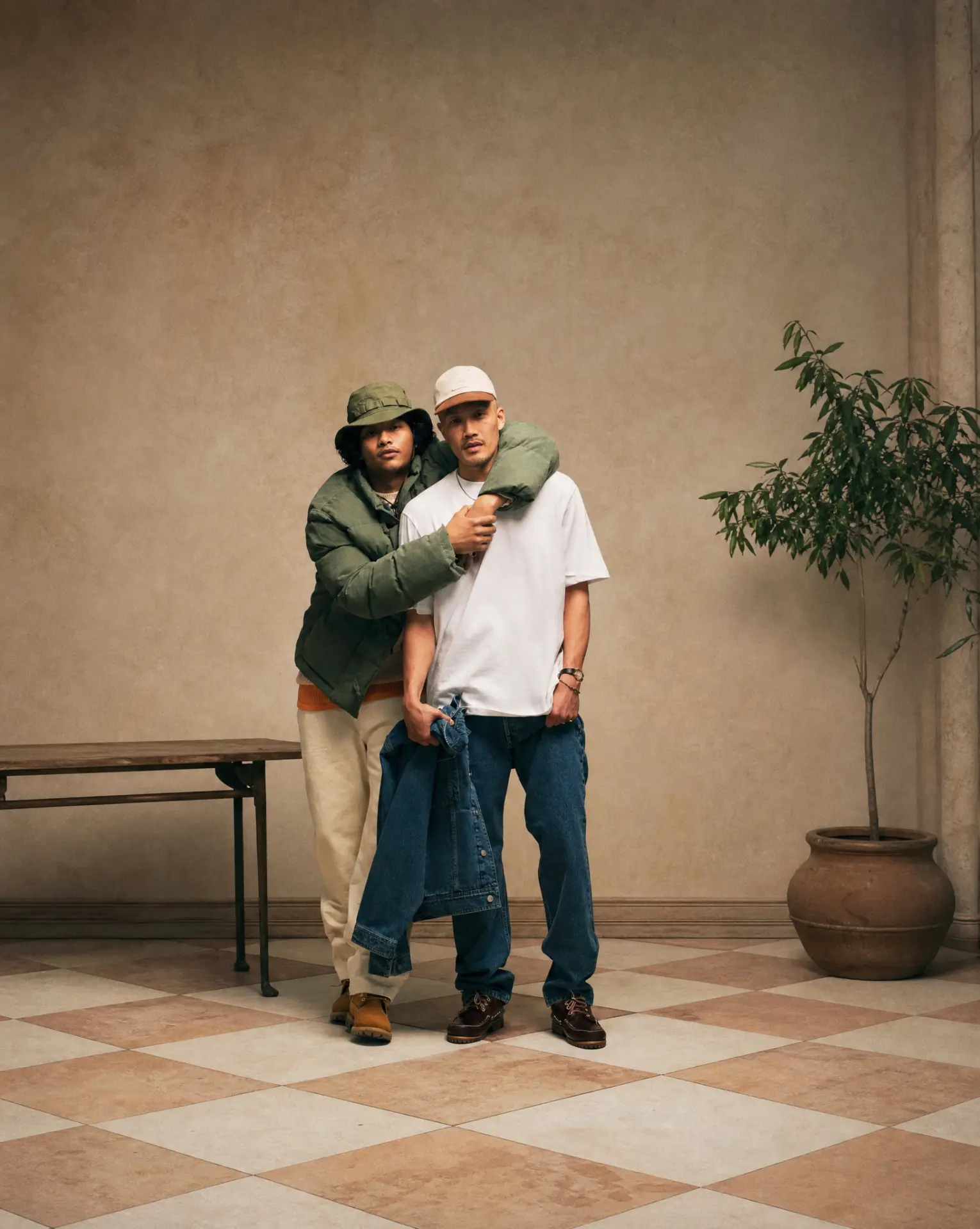 Two stylish men in warm interior